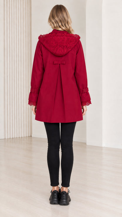 Back view of women's red hooded coat showing lace hood and box pleat