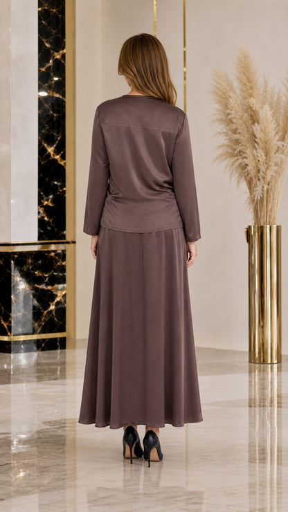 Back view of woman wearing elegant taupe satin maxi gown