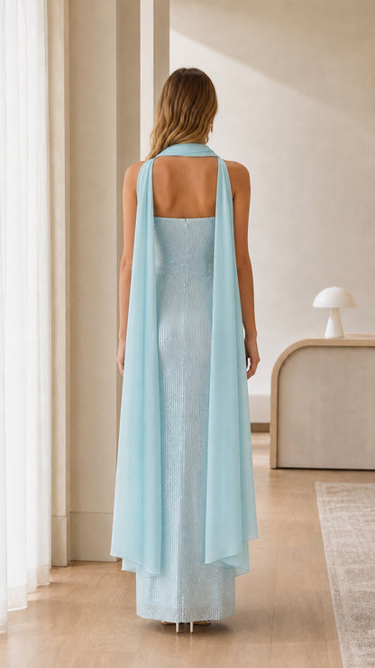 Back view of light blue strapless evening gown showing drape of the chiffon cape scarf