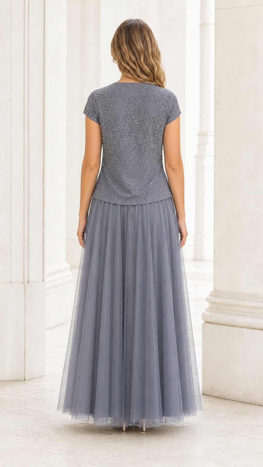 Back view showing the flowing grey tulle skirt