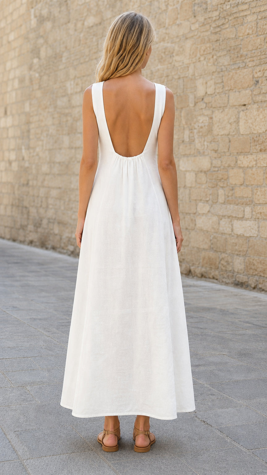 Back view highlighting low scoop back of white maxi dress