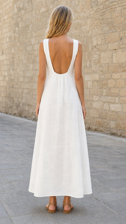 Back view highlighting low scoop back of white maxi dress