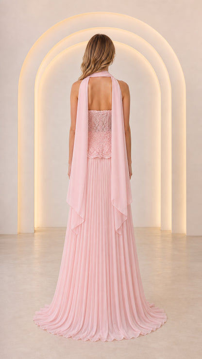 Back view of model in Blush Pink pleated evening dress showing back scarf drape detail