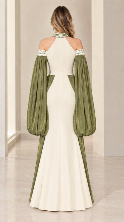 Back view of model in ivory and olive halter evening gown with cut-out back