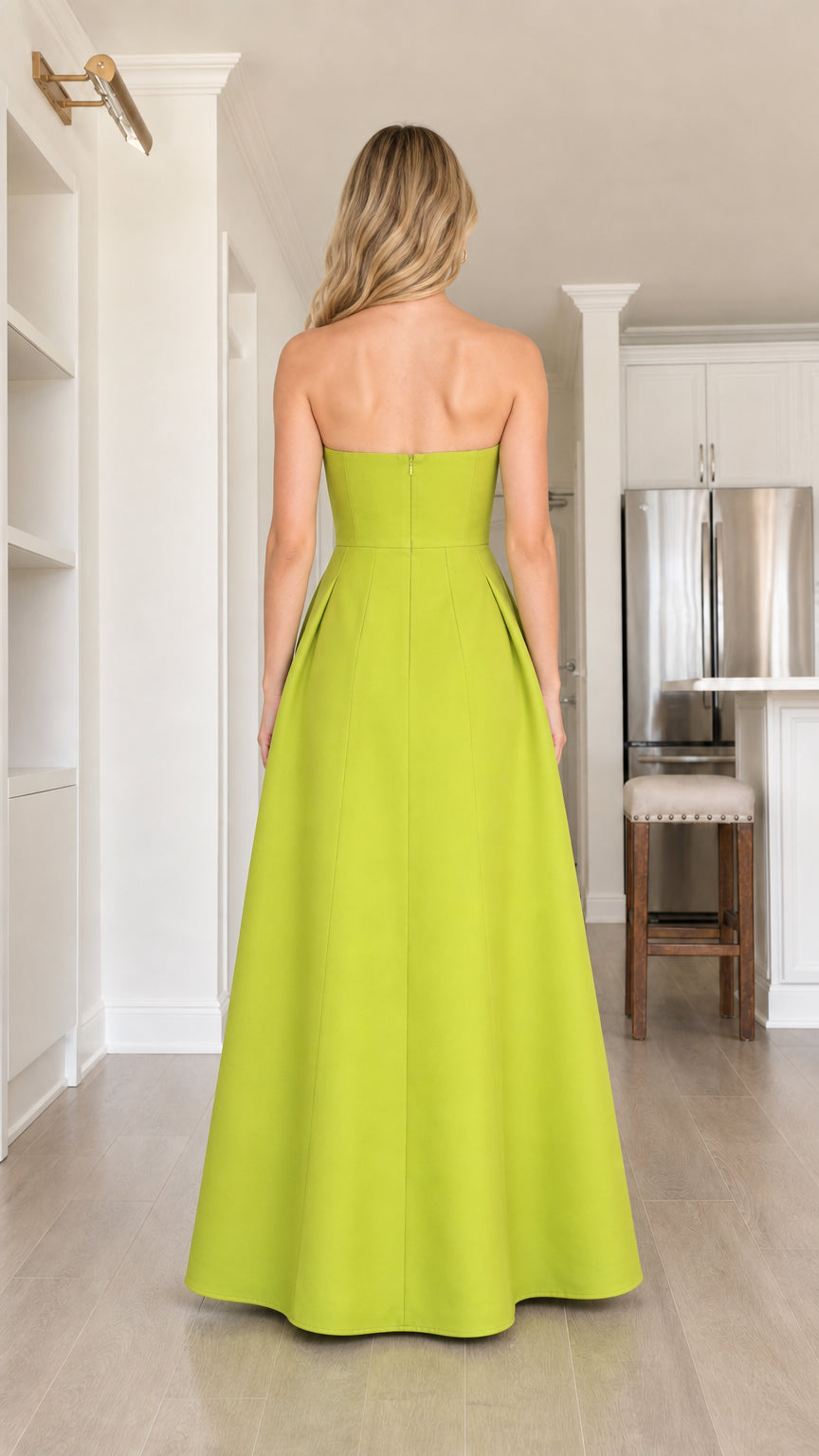 Back view of model in solid lime green strapless evening dress