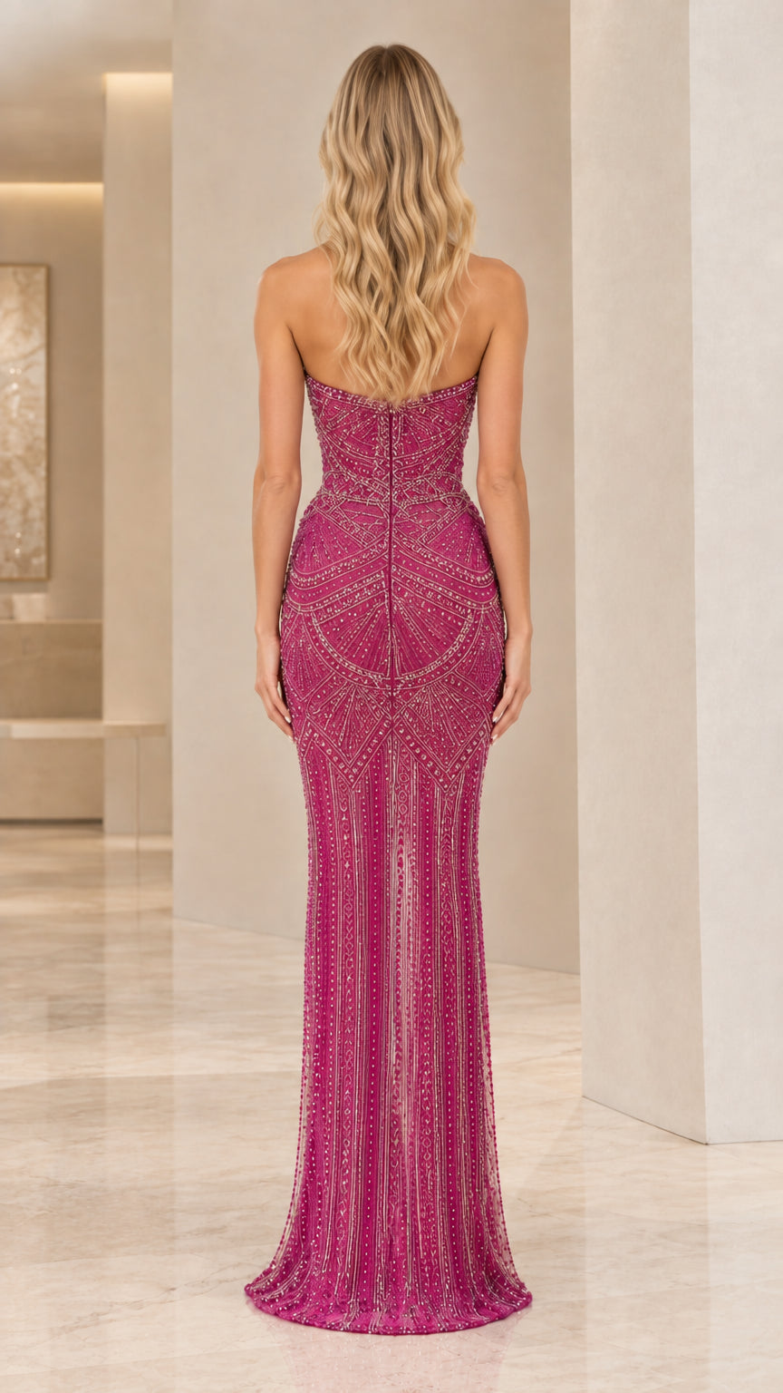 Back view of strapless beaded magenta formal gown with zipper detail