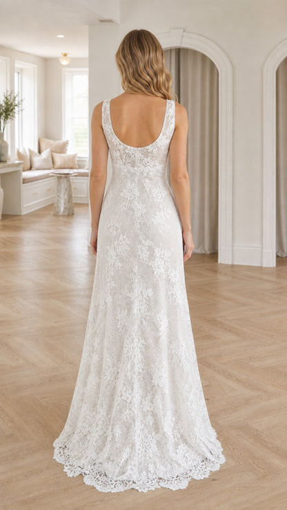 Back view of model showcasing scoop back and lace train of white dress