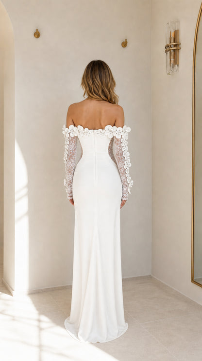 Back view of white evening dress with sweep train