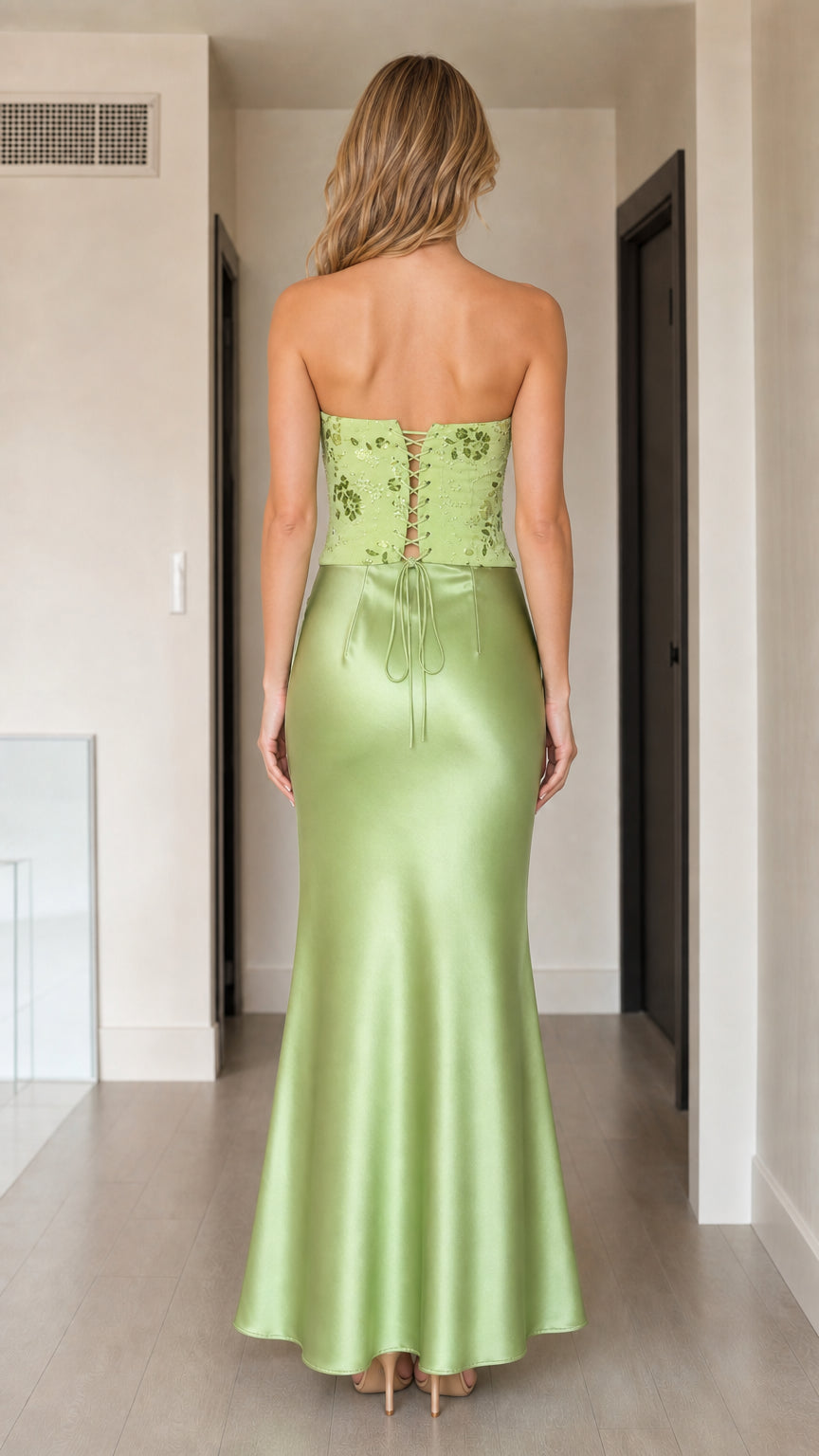 Back view of sage green strapless evening gown showing lace-up corset detail