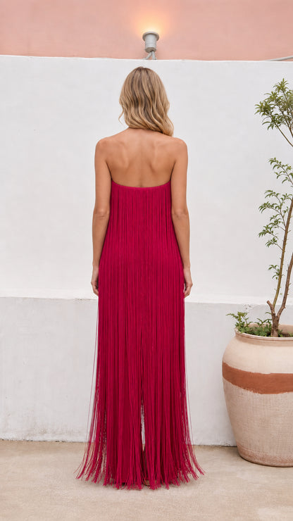 Back view of floor-length strapless fringe evening dress in magenta