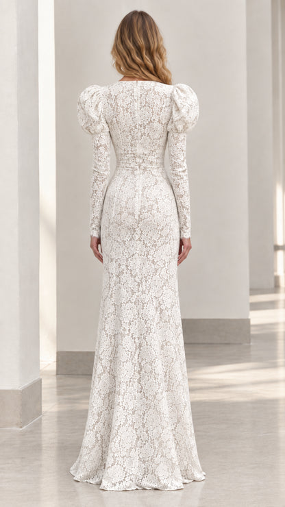 Back view of floor-length white lace dress showing elegant fit