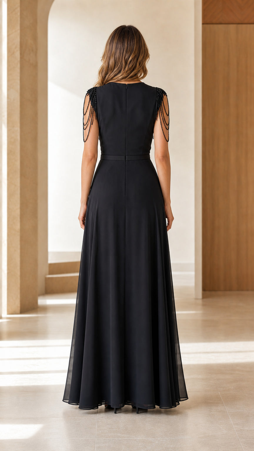 Back view of black wide-leg jumpsuit showing clean back design