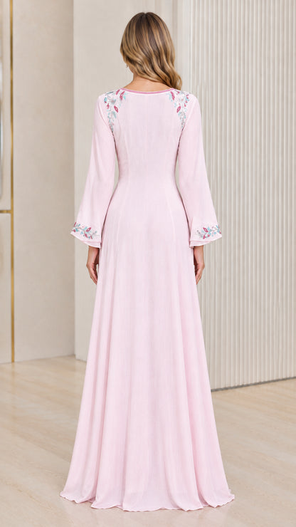 Back view of woman wearing Light Pink long sleeve maxi gown