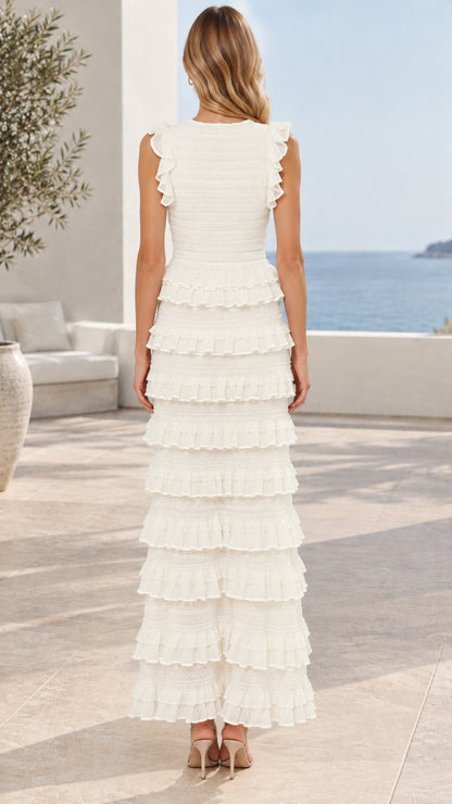 Back view of model wearing white sleeveless tiered ruffle maxi dress