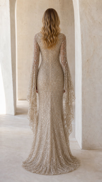 Back view of champagne sequin formal dress with elegant mermaid puddle train