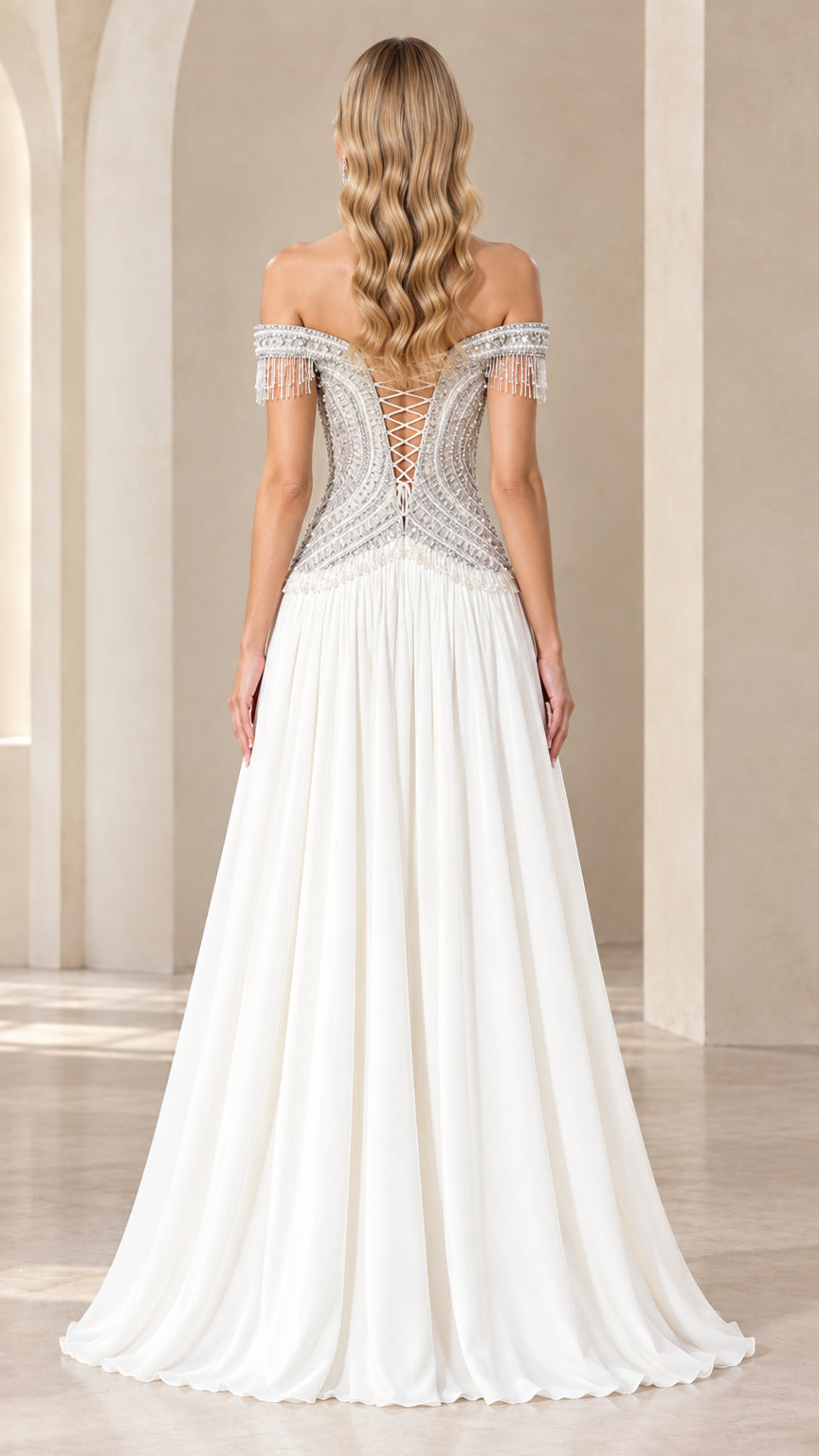 Back view of white formal gown showcasing lace-up corset back and beaded details