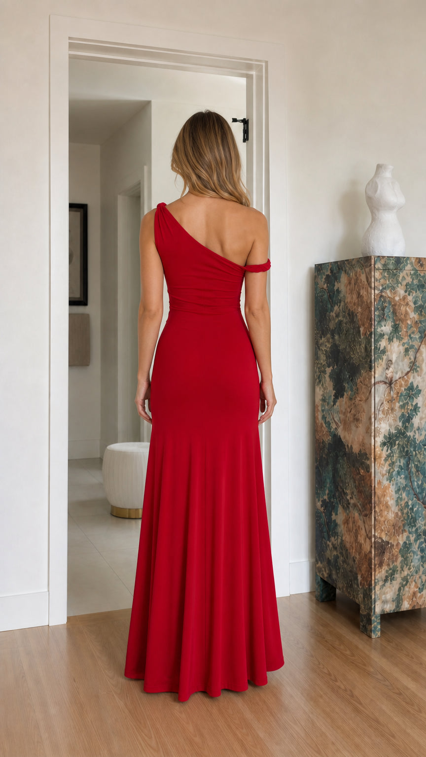 Back view of model in an asymmetrical red formal maxi dress