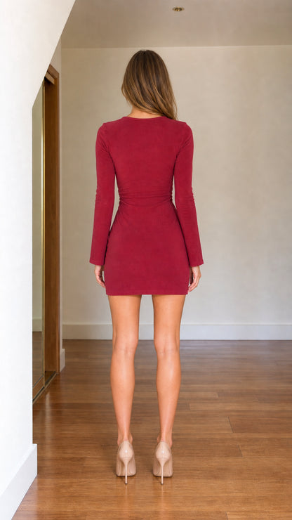 Back view of model in burgundy long sleeve bodycon mini dress