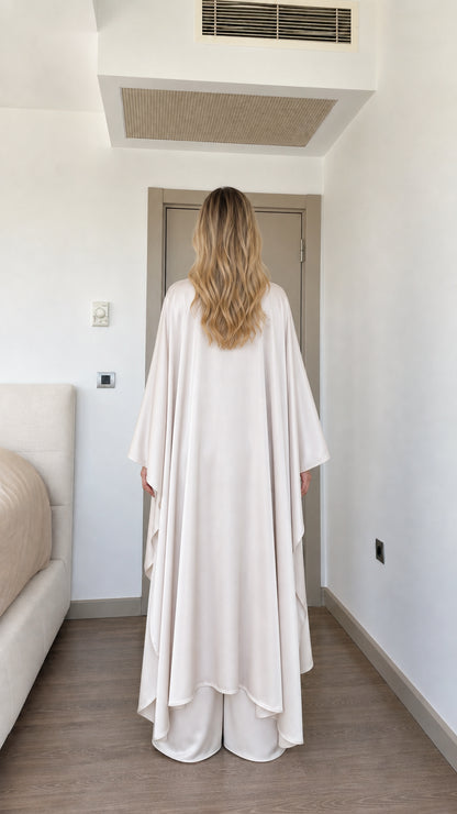 Back view of woman wearing Cream fluid drape satin cape tunic set