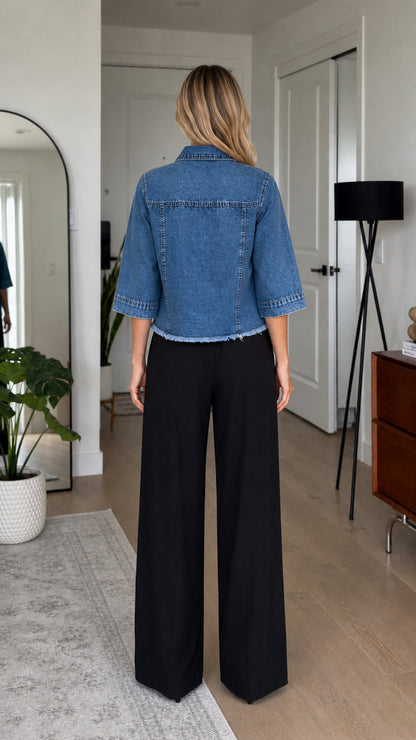 Back view of model in blue denim shirt jacket