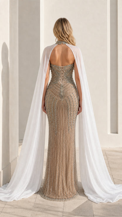 Back view showcasing open back and floor-length sheer cape