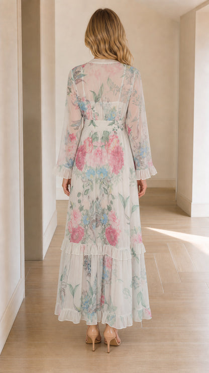 Back view of woman wearing white floral long sleeve maxi dress