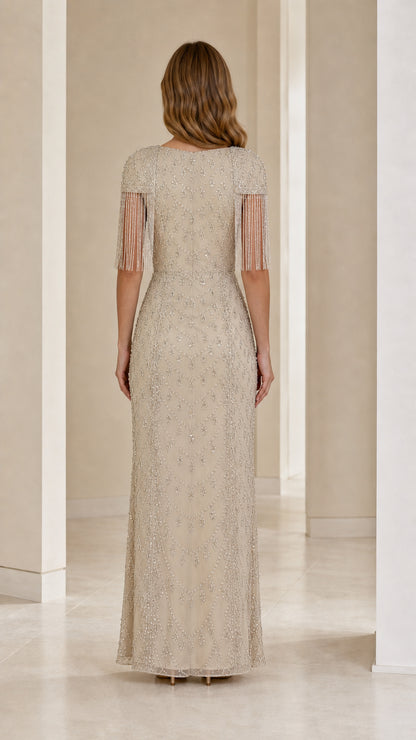 Back view of champagne floor-length formal gown with beaded embroidery