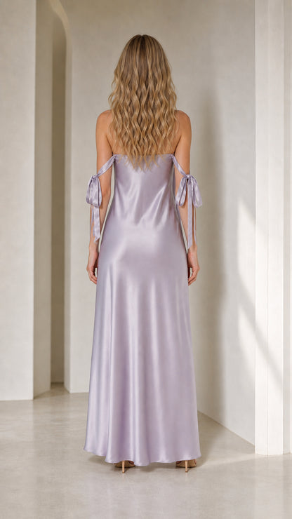 Model in lavender satin maxi dress from back view