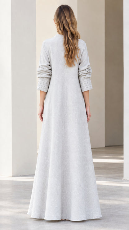 Back view of light grey modest mock neck maxi dress showing clean line and zip