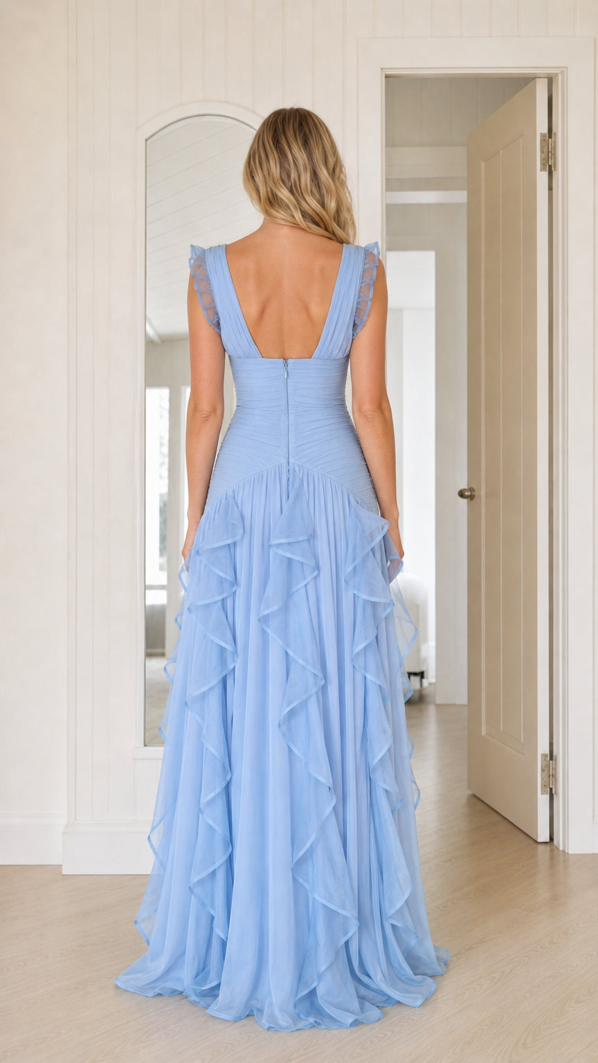 Back view of woman wearing sky blue open back sleeveless formal dress
