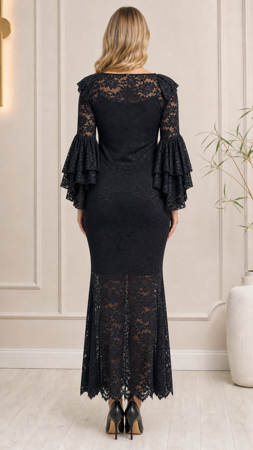 Back view of black long sleeve lace mermaid formal dress