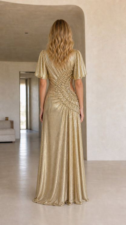 Back view of woman showcasing the fit and drape of the gold maxi dress