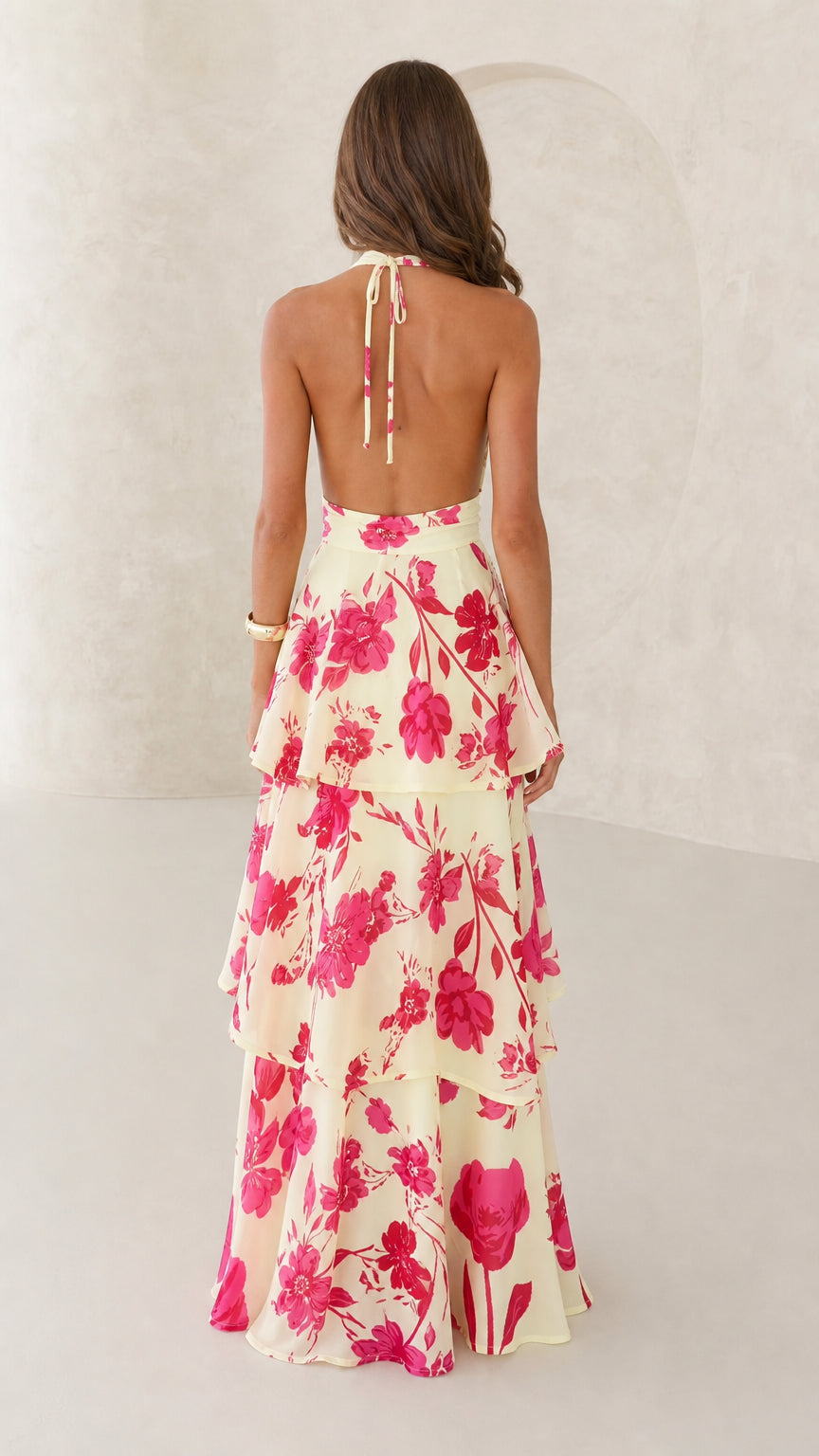 Back view showing tie straps of yellow floral maxi dress