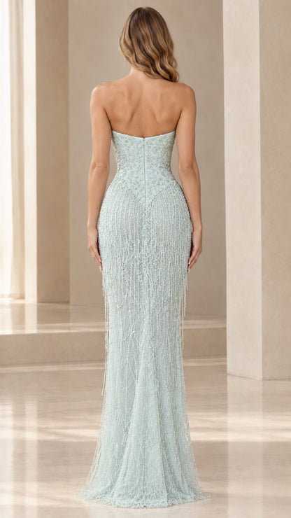 Back view of model wearing mint green strapless beaded maxi gown