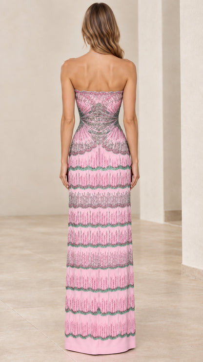 Back view of woman wearing pink strapless beaded formal gown