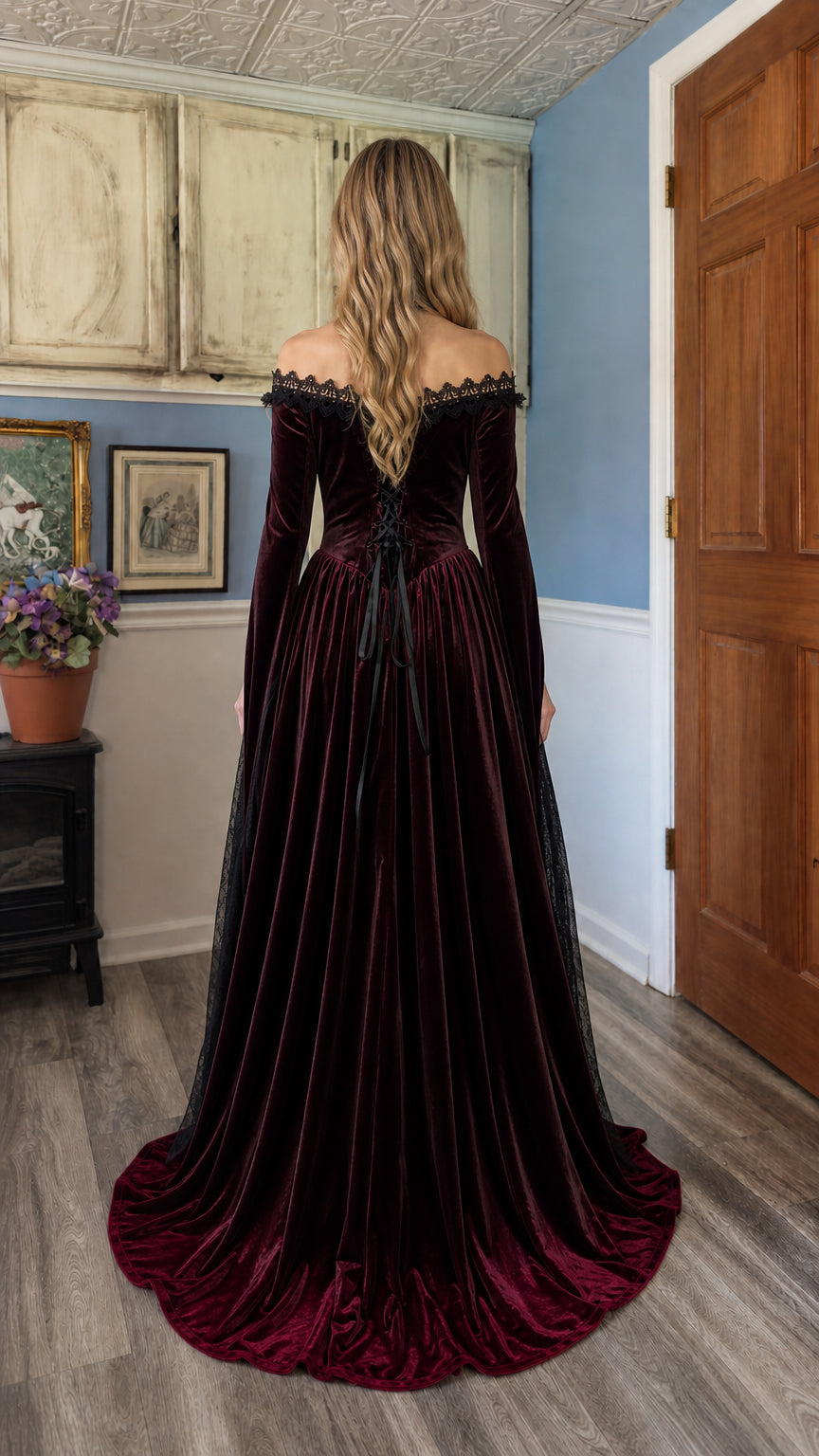 Model wearing Burgundy velvet gown from behind showing lace-up back