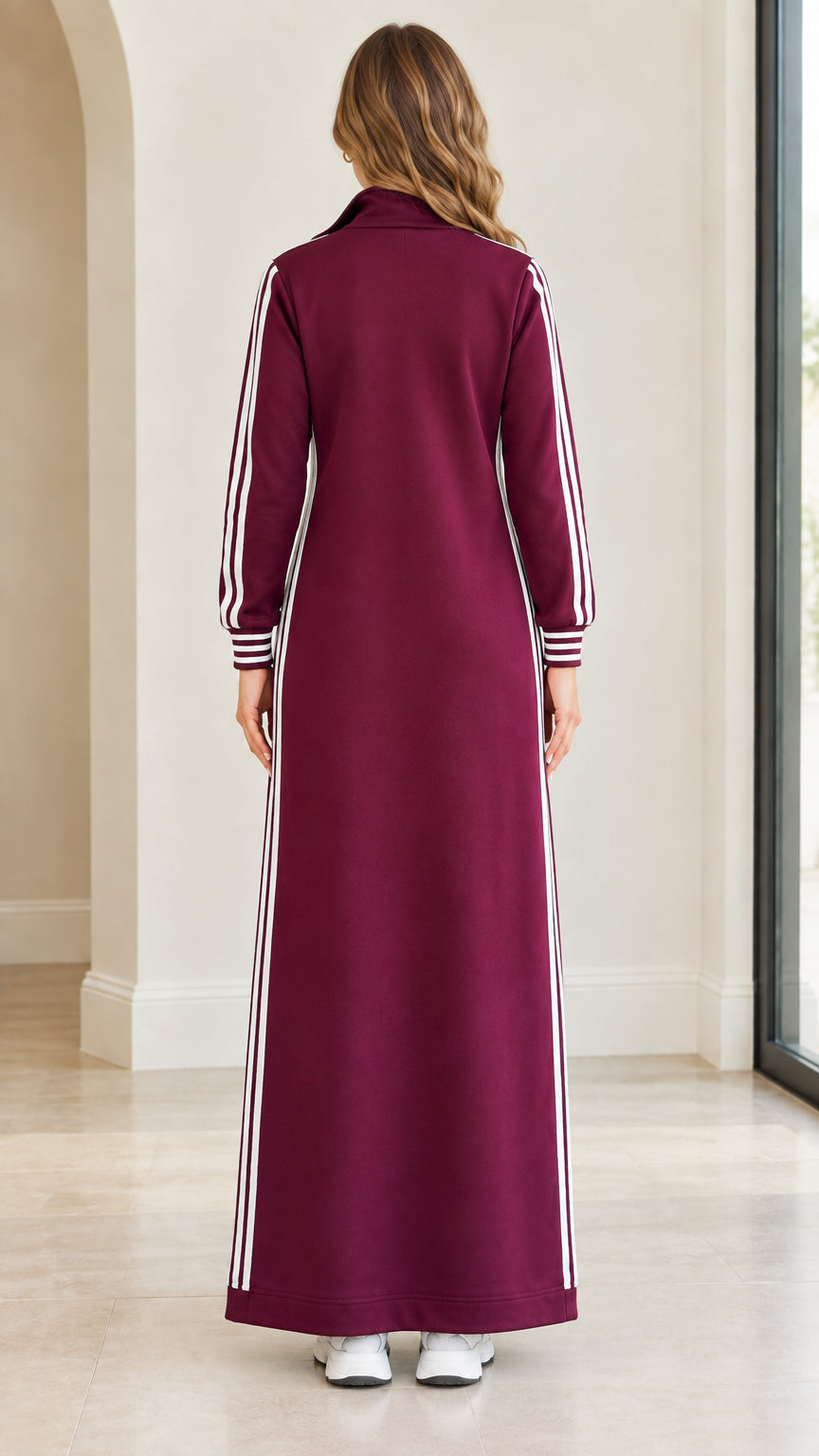 Back view of woman wearing burgundy full-length sweatshirt dress