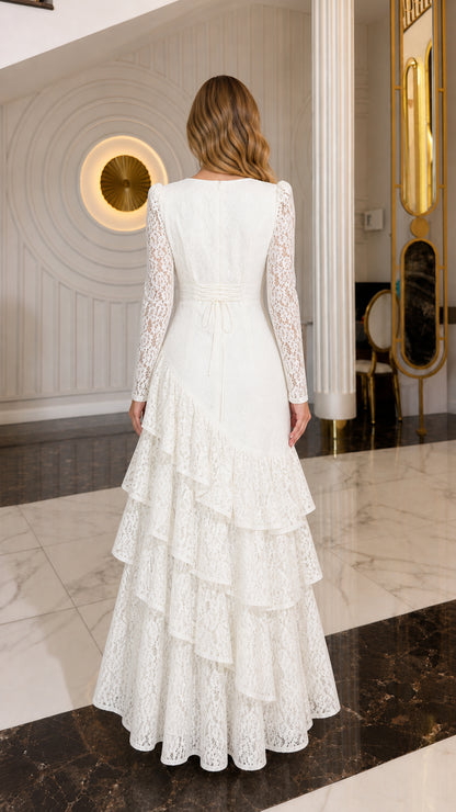 Back view of model wearing ivory long-sleeve lace evening gown