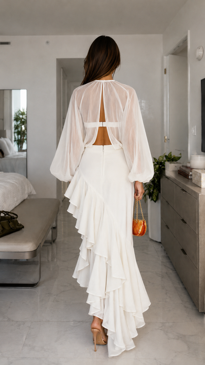 Back view of white cutout maxi dress with open back and layered ruffle hem