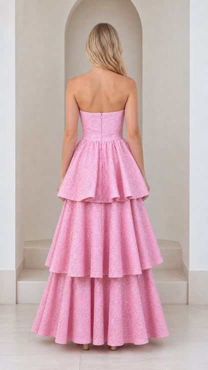 Back view of model showing strapless bodice and tiered skirt