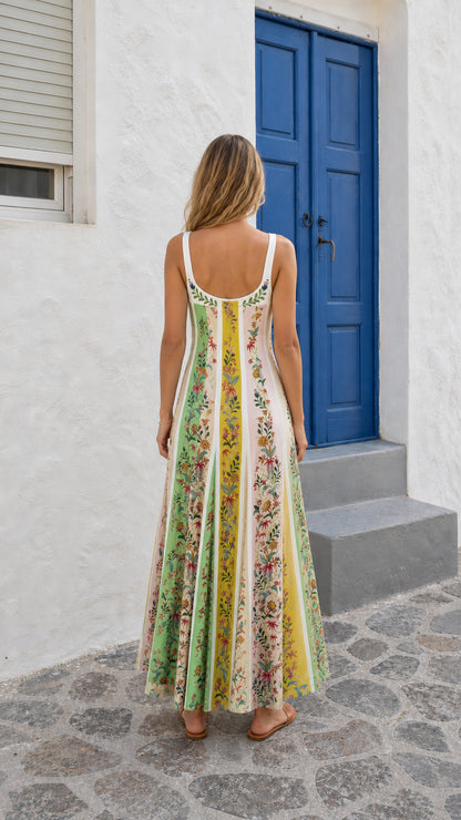 Back view of woman in multi-color floral panel maxi dress