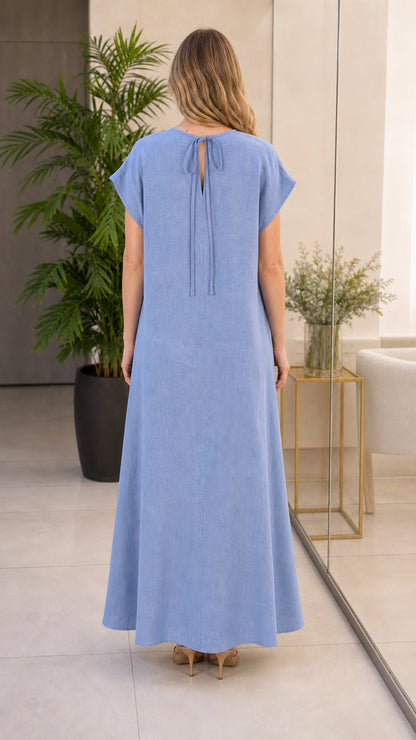 Back view of sky blue maxi dress highlighting back neck tie detail