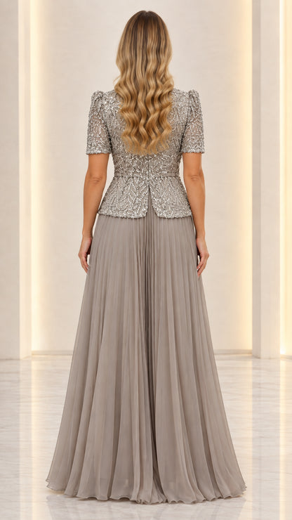 Back view of slate grey sequin evening dress with pleated maxi skirt