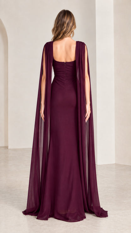 Back view of burgundy cape evening dress showing open square back