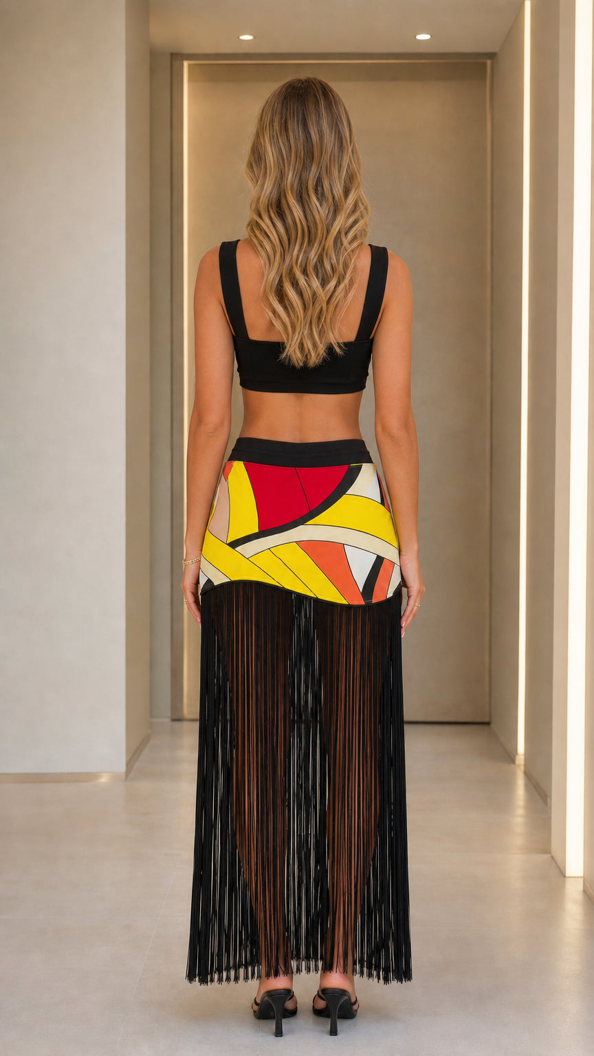Back view of geometric patchwork fringe maxi skirt set