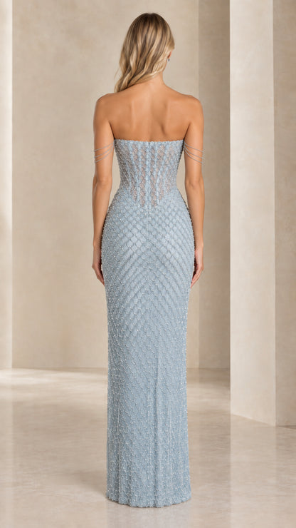 Back view of model wearing Ice Blue beaded corset formal maxi dress