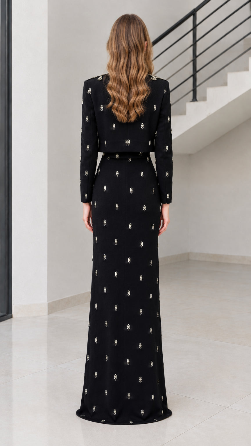 Back view of black floor-length formal dress and long-sleeve bolero jacket