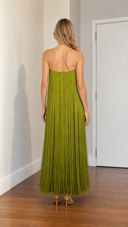 Back view of woman wearing olive green strapless fringe gown