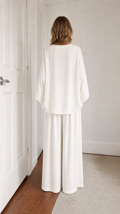 Back view of model in white two-piece lounge set