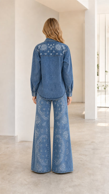 Back view of woman wearing Classic Blue paisley print denim shirt and wide-leg trousers